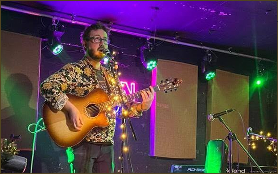 Gary Davies performing acoustic music in a pub venue
